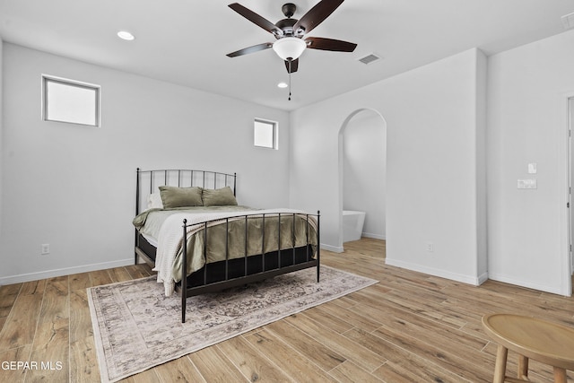 bedroom with baseboards, recessed lighting, visible vents, and light wood-style floors