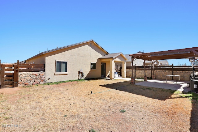 back of house featuring a pergola and a patio area