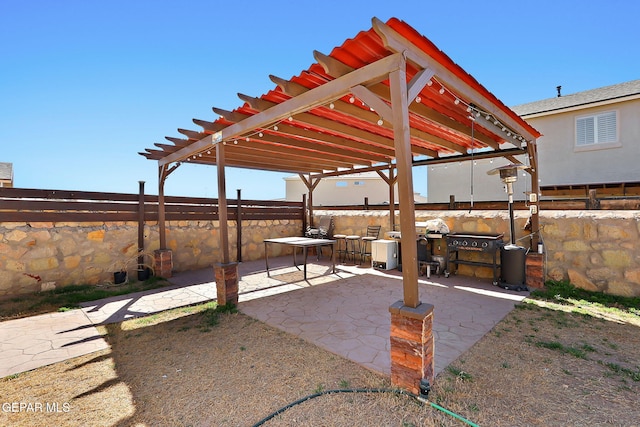 view of patio featuring a pergola