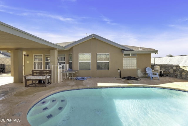 view of swimming pool with a patio