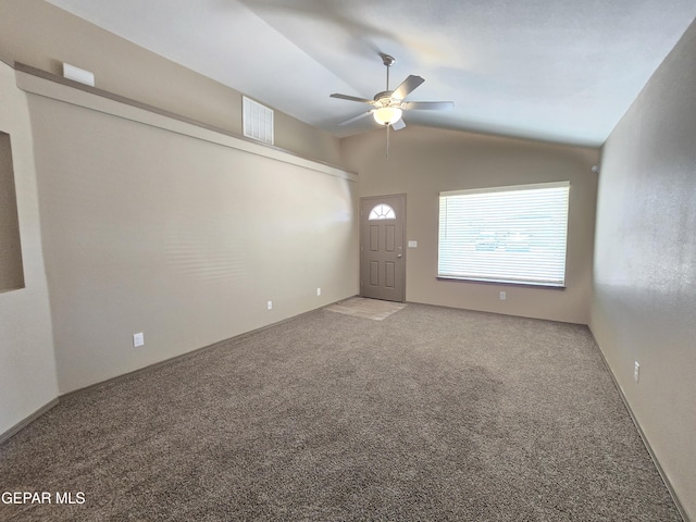 carpeted empty room with lofted ceiling and ceiling fan