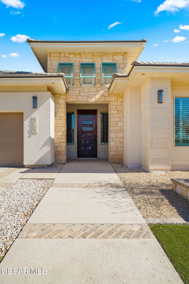 entrance to property featuring a garage