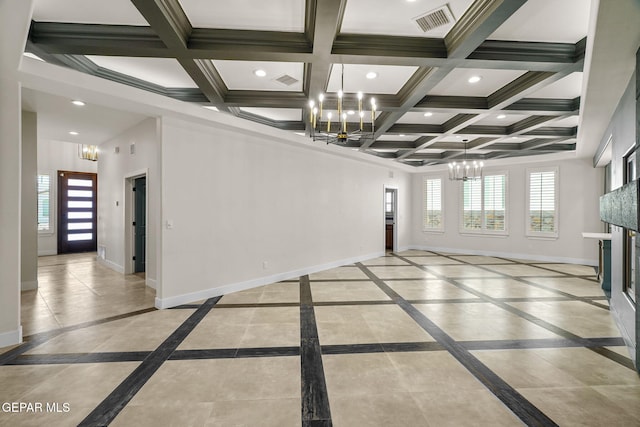 unfurnished living room featuring ornamental molding, coffered ceiling, and a notable chandelier