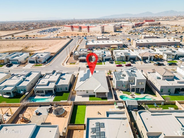 birds eye view of property with a mountain view