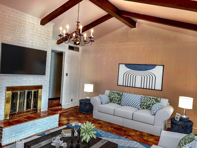 living room featuring a fireplace, lofted ceiling with beams, and a notable chandelier