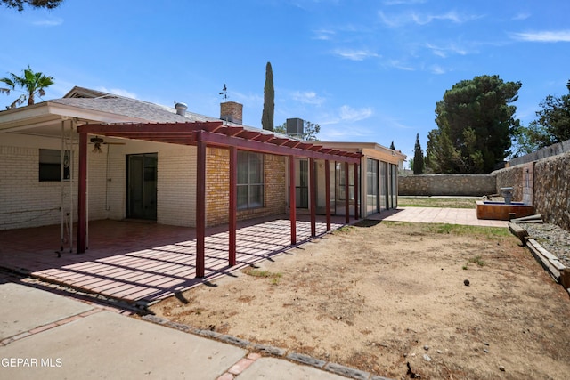 11204 Bob Mitchell Dr, El Paso, TX 79936 - rear view of property with a chimney, central air condition unit, a fenced backyard, a patio area, and brick siding