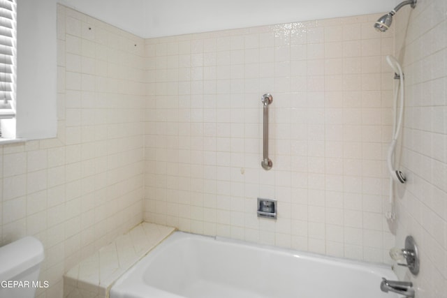 11204 Bob Mitchell Dr, El Paso, TX 79936 - full bath with tile walls, toilet, and bathtub / shower combination