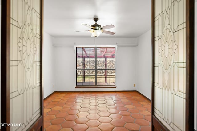 11204 Bob Mitchell Dr, El Paso, TX 79936 - unfurnished bedroom with baseboards and ceiling fan