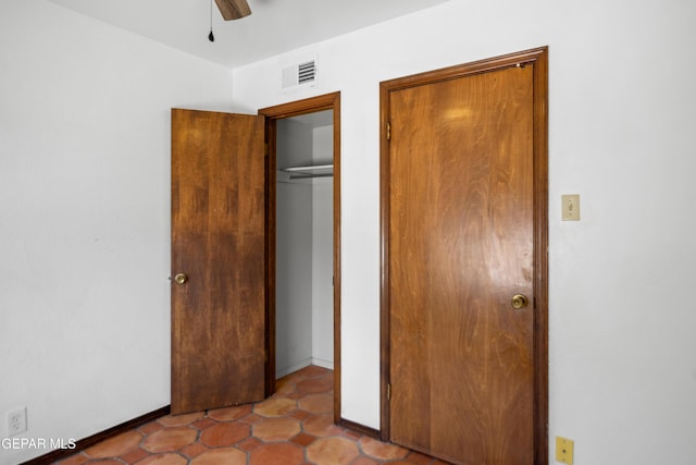 11204 Bob Mitchell Dr, El Paso, TX 79936 - unfurnished bedroom featuring ceiling fan, baseboards, and visible vents