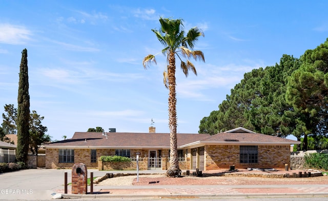 11204 Bob Mitchell Dr, El Paso, TX 79936 - single story home with brick siding and a chimney