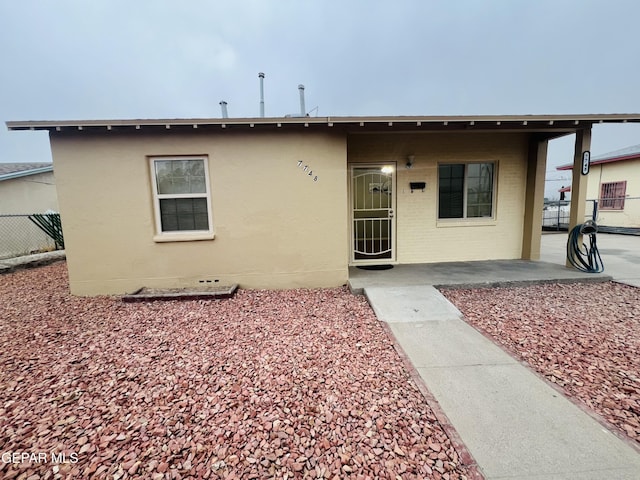 view of front of house with a patio area