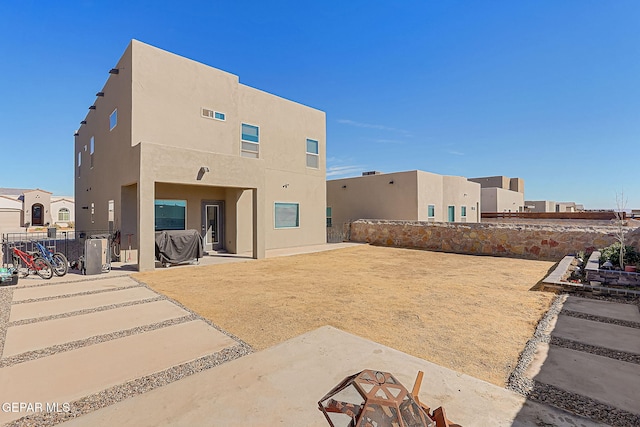 back of house featuring a patio