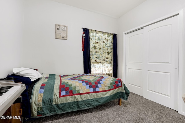 carpeted bedroom featuring a closet