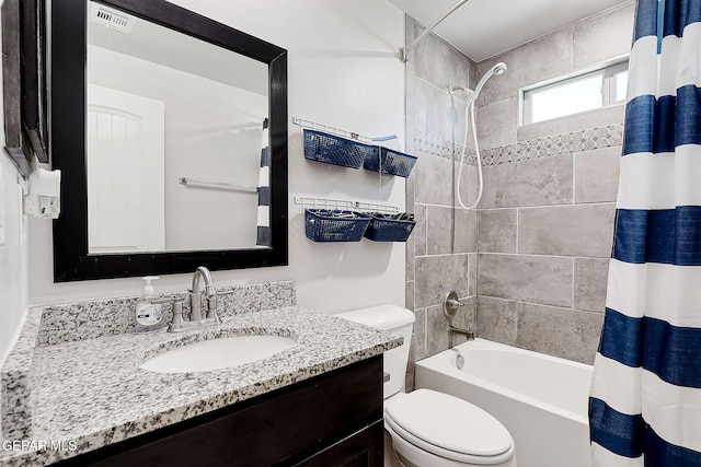 full bathroom featuring shower / bath combination with curtain, vanity, and toilet