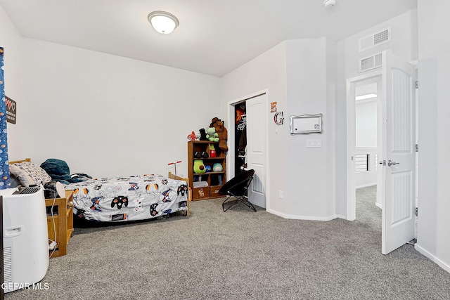 carpeted bedroom featuring a closet