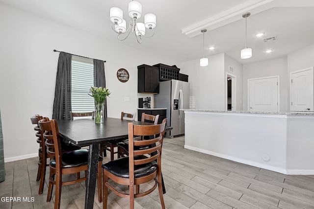 dining room featuring a notable chandelier