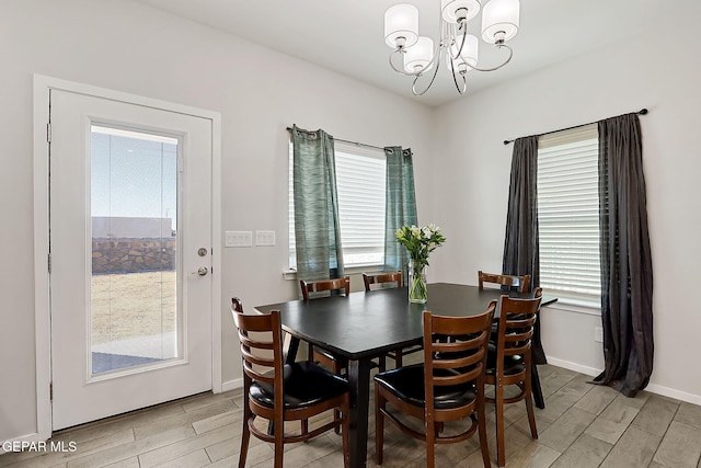 dining space featuring an inviting chandelier