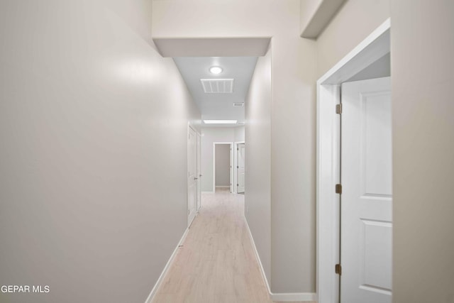 corridor featuring light hardwood / wood-style floors