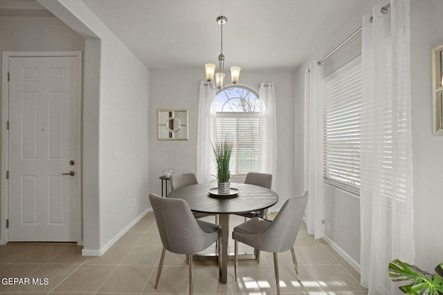 905 Summer Lake St, El Paso, TX 79928 - dining room featuring light tile patterned flooring and a notable chandelier