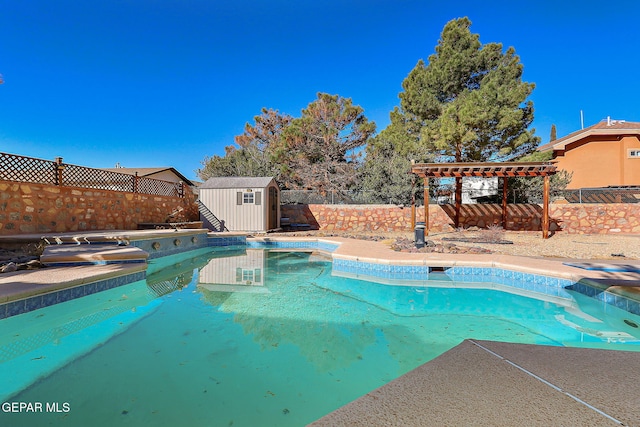 view of swimming pool featuring a storage shed