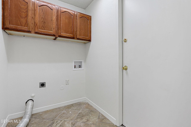 laundry area with gas dryer hookup, cabinets, hookup for a washing machine, and electric dryer hookup