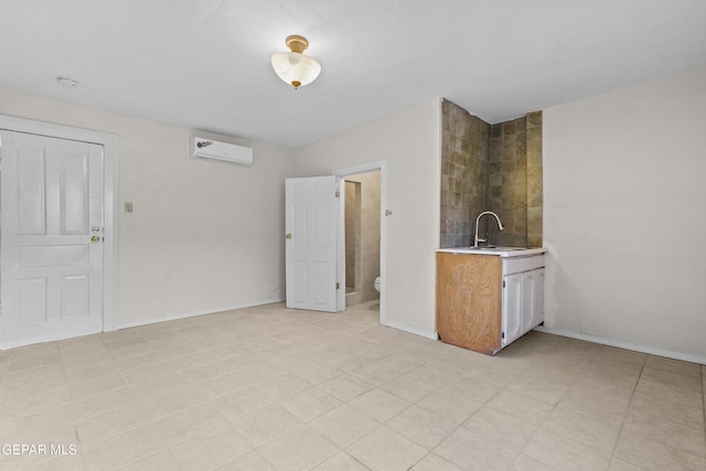 interior space with sink and a wall unit AC