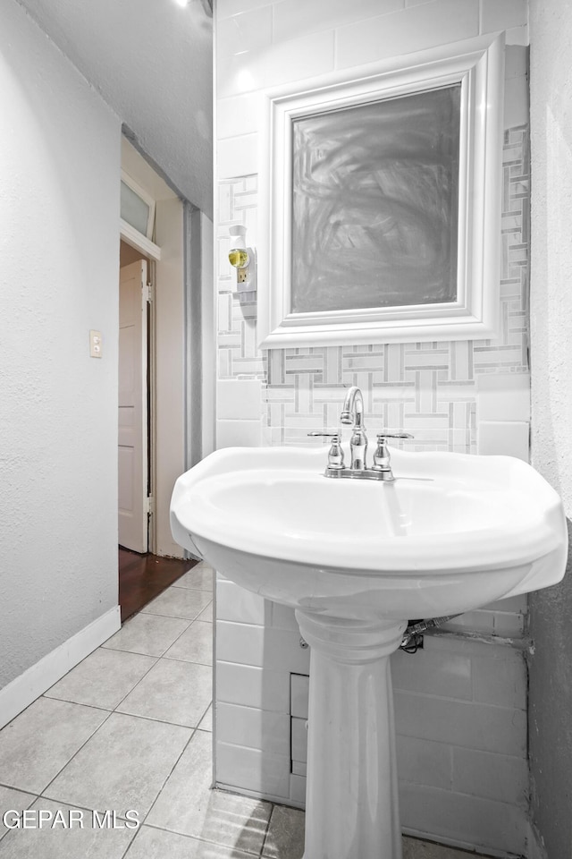 bathroom featuring tile patterned flooring and sink