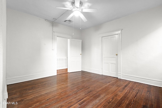 unfurnished bedroom with dark wood-type flooring and ceiling fan