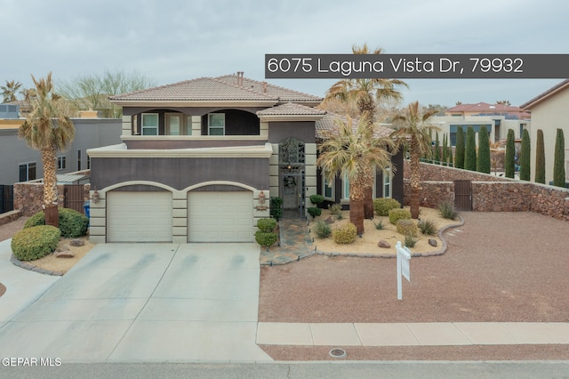 mediterranean / spanish-style home featuring a garage