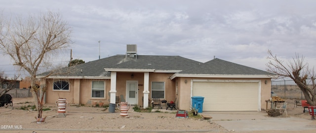 ranch-style house featuring a garage