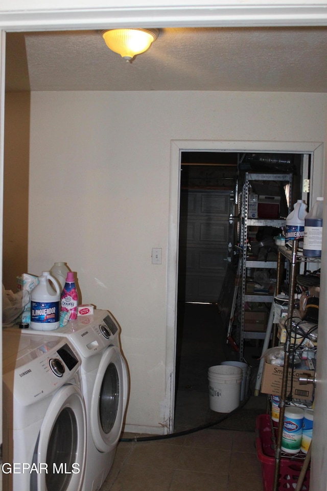 washroom featuring tile patterned flooring and independent washer and dryer