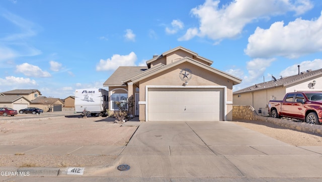 view of front of home with a garage