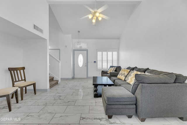 living room featuring high vaulted ceiling and ceiling fan