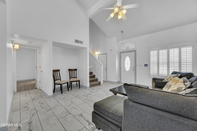 living room featuring high vaulted ceiling and ceiling fan