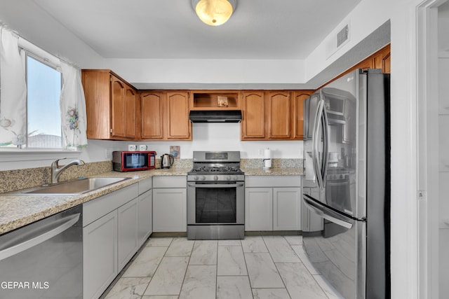 kitchen featuring stainless steel appliances and sink