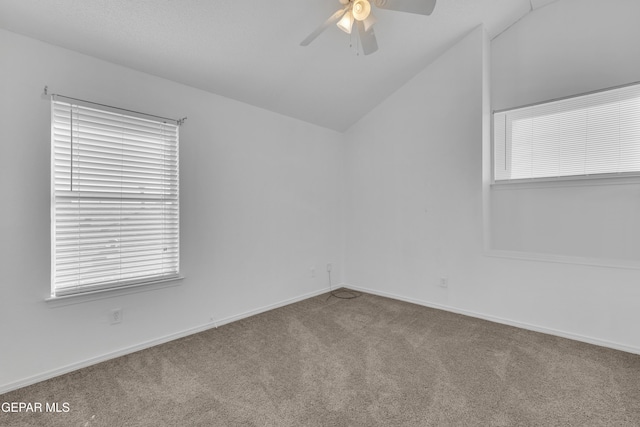 unfurnished room with vaulted ceiling, carpet floors, and ceiling fan