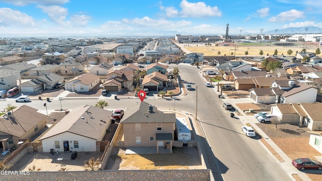 birds eye view of property with a mountain view