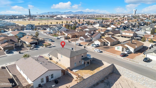 birds eye view of property with a mountain view