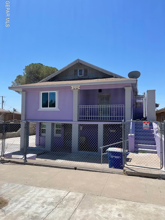 view of front of house with a balcony