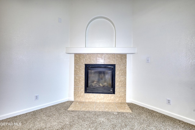 room details with carpet flooring, a fireplace, and baseboards