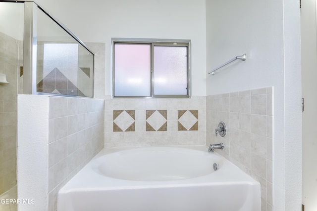 bathroom with a garden tub