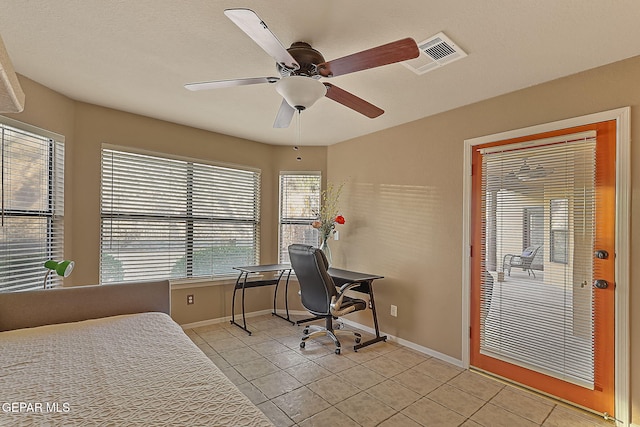 bedroom with light tile patterned floors and ceiling fan