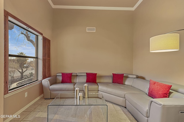 living room featuring crown molding and light tile patterned floors