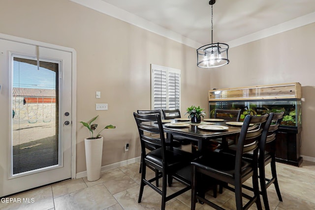 dining space with plenty of natural light, light tile patterned floors, and an inviting chandelier