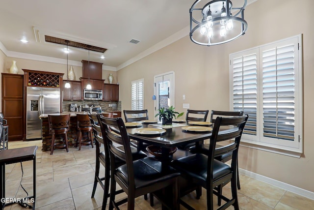 dining area featuring ornamental molding