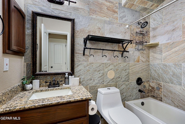 full bathroom with vanity, toilet, and tiled shower / bath