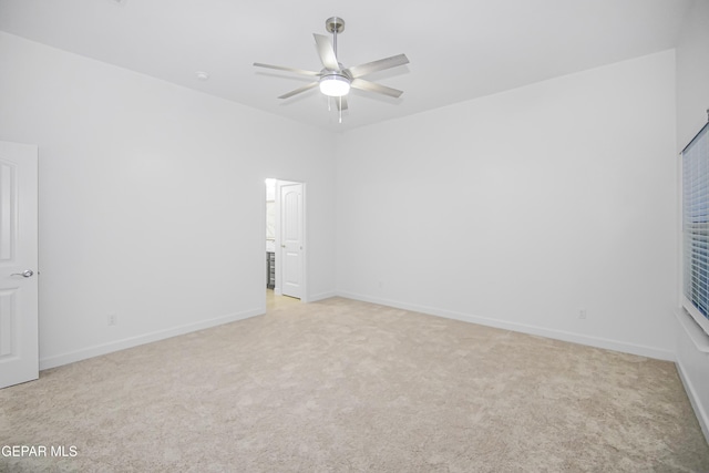 carpeted empty room with ceiling fan