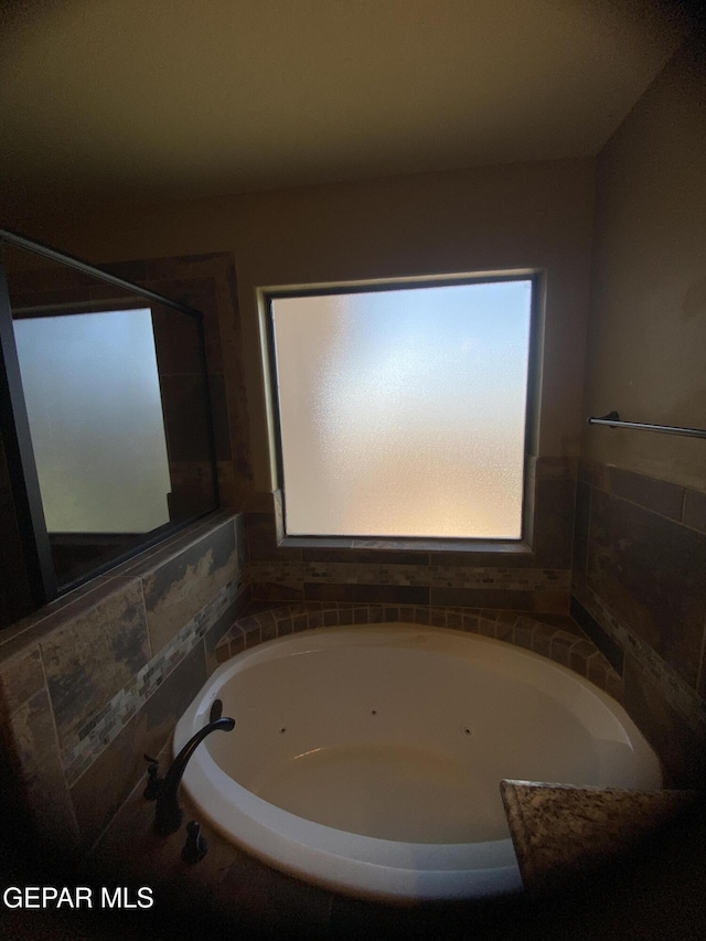 bathroom with a washtub