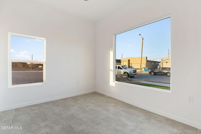 empty room featuring baseboards