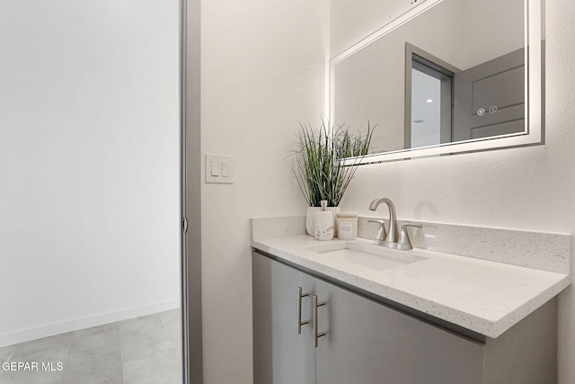 bathroom with vanity and baseboards